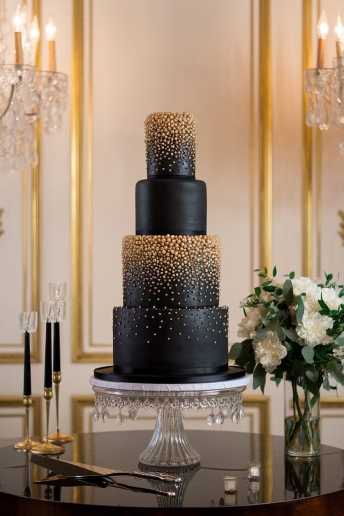 1. Sophisticated Black Wedding Cake with Gold Pearls