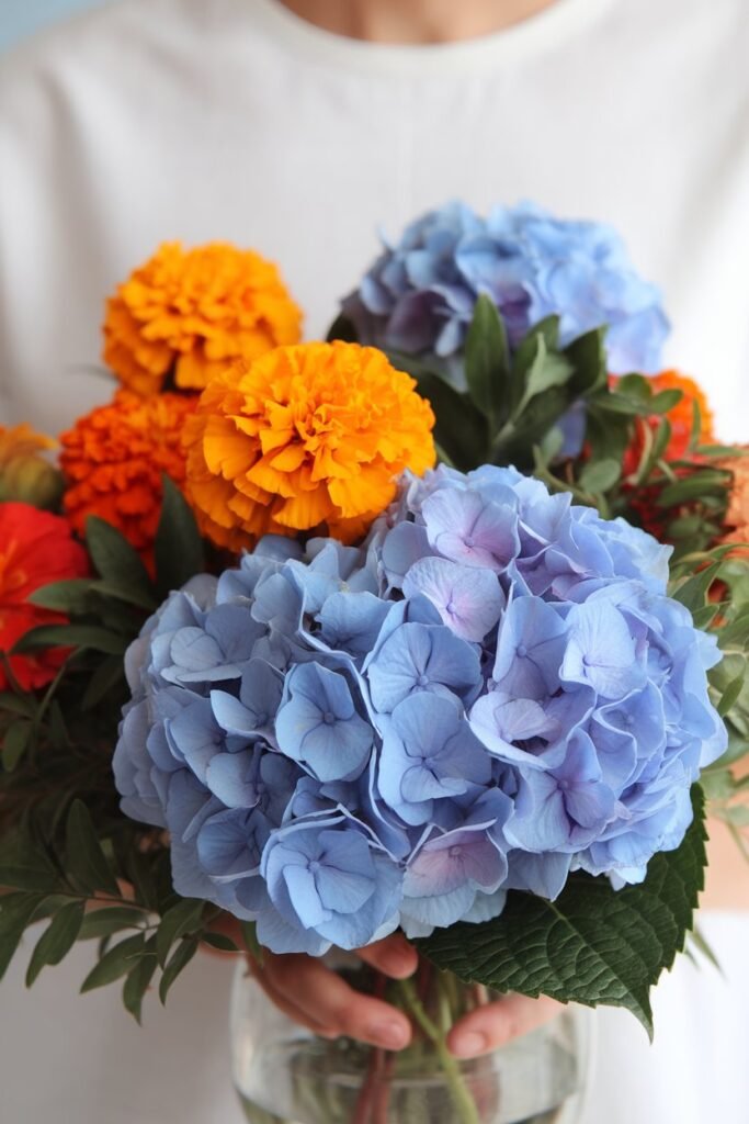 2. Hydrangeas and Marigolds for Bold Color Contrast