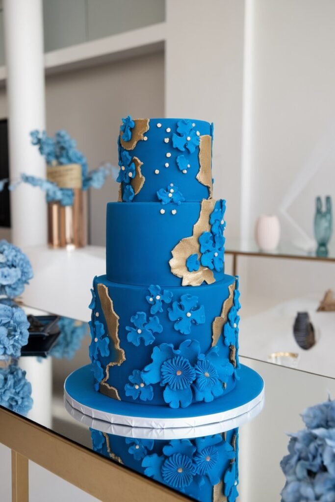 A Bold Blue Wedding Cake with Golden Accents